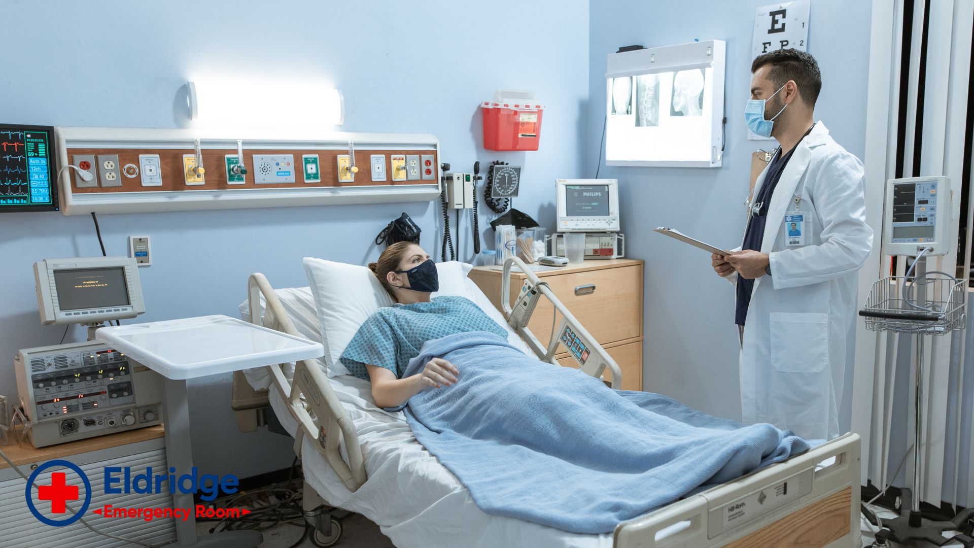 Physician reviewing care at a patient bedside